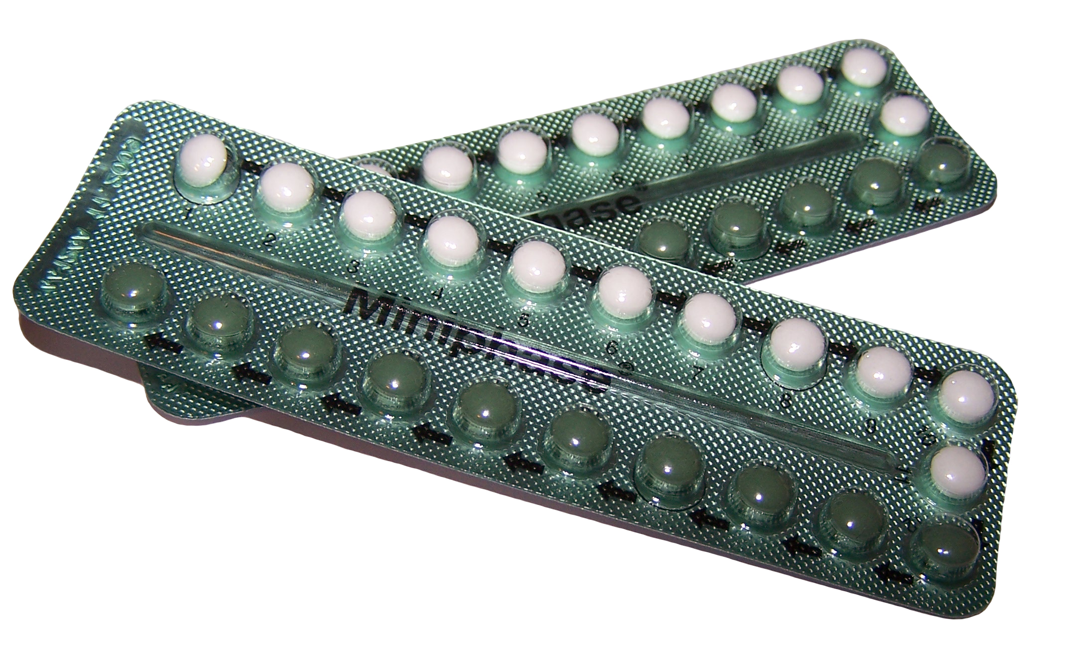 Blister packs of combined oral contraceptive pills on a white background