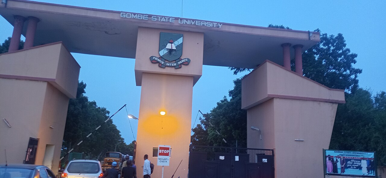 Entrance gate of Gombe State University at dusk, used as a clearly labelled file image from a different institution in the state