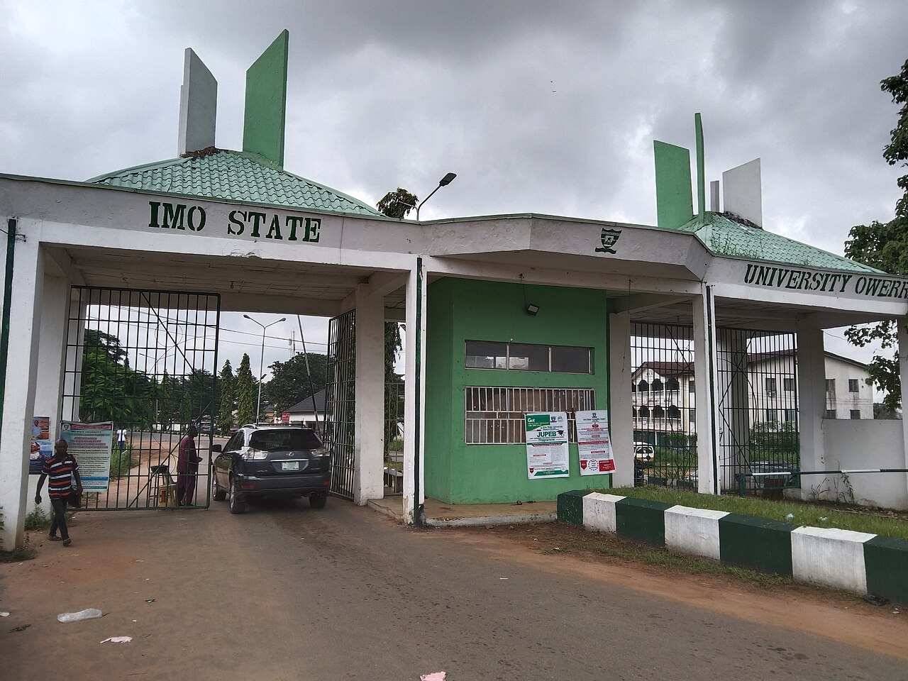 The green and white front gate of Imo State University in Owerri, Nigeria