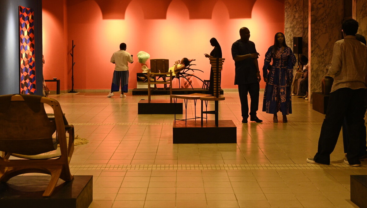 Visitors examine furniture and lighting at a Design Week Lagos exhibition in 2025