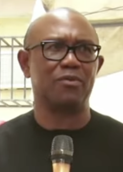 Peter Obi at a public event, holding a microphone