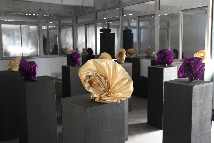 Reflective fabric sculptures in a gallery at an earlier Lagos Biennial, shown as an archival image