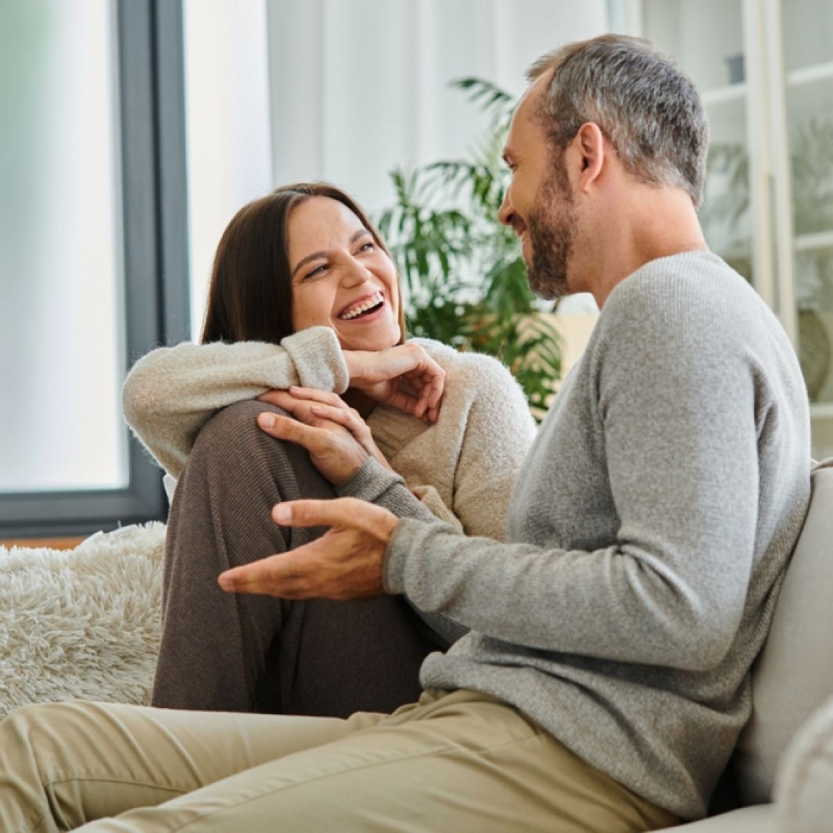 An illustrative image of a couple sharing a warm conversation at home